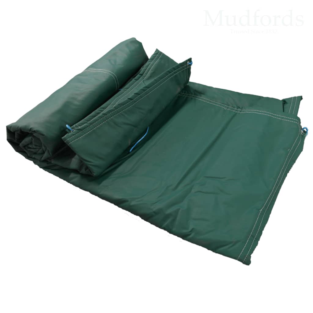 Folded insulated tarpaulin with blue PVC top layer, heavy‑duty felt insulation, and sturdy jute underside; rope‑reinforced hems and brass eyelets visible.